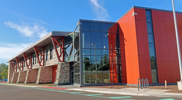Glazed entrance and red exterior facade at the Scudder Falls project